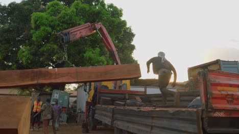 working-class-black-labor-in-sawmill-factory-in-africa-exporting-cut-wooden-tree-trunk-oversea
