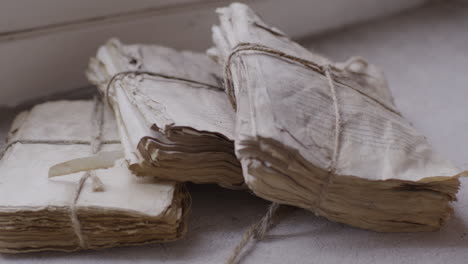 Ancient-scholars-study-religious-texts-on-weathered-scrolls-and-documents