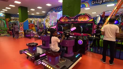 POV-SHOT,-A-kid-is-playing-a-game-with-a-gun-inside-the-mall