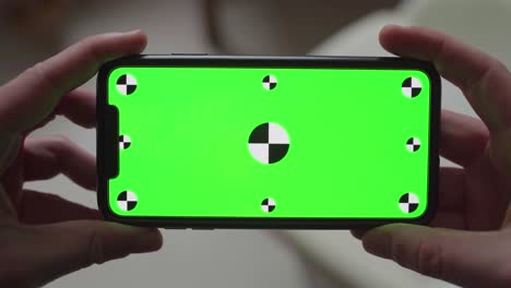 Close-up-of-latest-smartphone-technology-with-integrated-green-screen