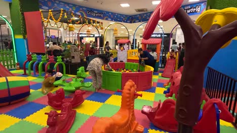 POV-SHOT-Mothers-playing-games-with-their-children-at-the-mall-games