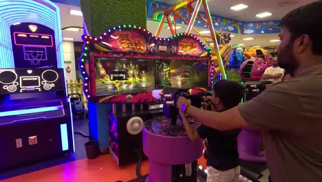 POV-SHOT-Father-playing-game-with-kid-in-Cam-Crazy-World-inside-the-mall