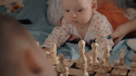 Baby-girl-is-curious-about-chess