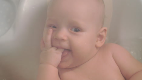 A-closeup-of-a-baby-girl-enjoying-bathing