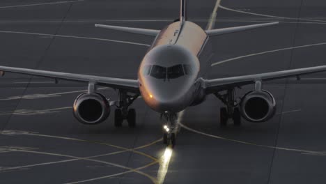 Aircraft-taxiing-at-the-airport-in-the-dusk