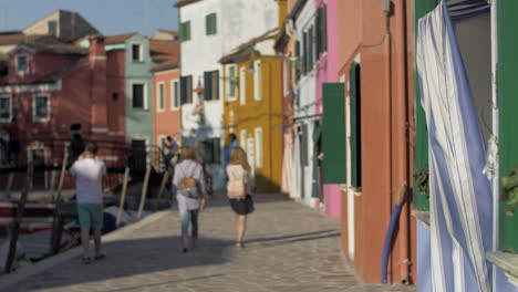 A-blurred-scenery-of-italian-Burano-with-walking-tourists