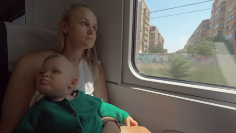 Baby-girl-traveling-with-mum-by-train