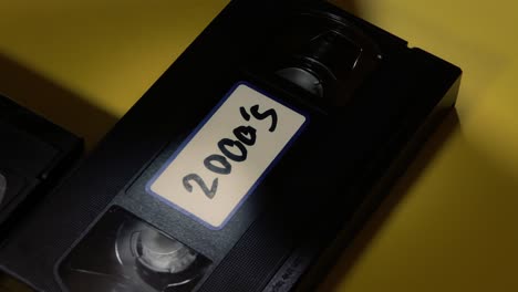 Picking-a-VHS-tape-with-a-label-on-it-and-putting-it-back