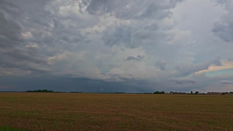 Cultivated-fields-under-storm-clouds-moving-through-timelapse