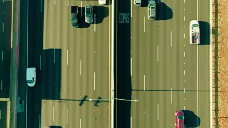 Dynamic-top-down-view-of-bustling-San-Francisco-traffic-on-a-sunlit-interstate