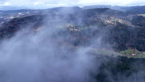 Aerial-of-fast-moving-and-swirling-clouds-in-Plainfaing-in-Vosges-in-4K