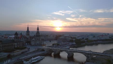 Dramatic-aerial-top-view-flight-Sunset-city-Dresden-Church-Cathedral-Bridge-River