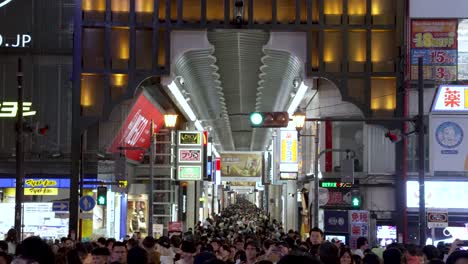 Crowded-Busy-View-Looking-Through-Namba-Ebisu-Bashi-Suji-Shopping-Street-from-Ebisubashi-Bridge-At-Night-In-Osaka