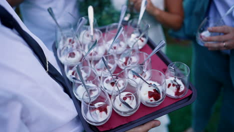 Server-Presenting-Gourmet-Dessert-Cups