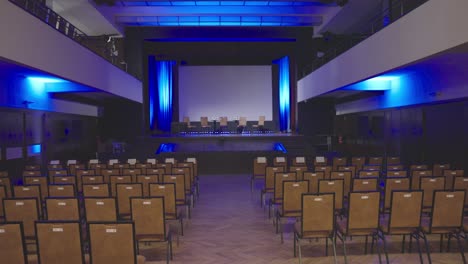 Empty-conference-room-with-empty-chairs-on-stage---sow-motion-dolly-shot