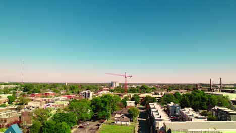 Red-construction-crane-in-Atlanta-suburbs-Georgia,-United-States