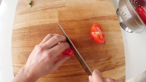 Point-of-view-of-man-chopping-tomato-and-mushroom