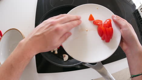 Point-of-view-of-man-cooking-vegetables-in-a-pan