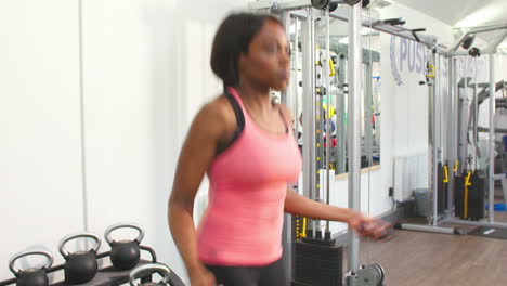 Young-African-American-woman-skipping-at-a-gym