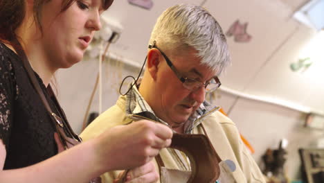 Apprentice-In-Bespoke-Shoemaker-Glueing-Together-Leather