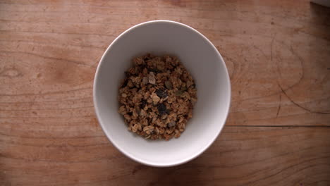 Point-Of-View-Shot-Of-Pouring-Muesli-Into-Bowl