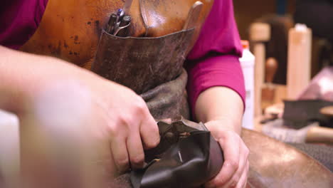 Bespoke-Shoemaker-Pinning-Leather-Together-To-Make-Shoe