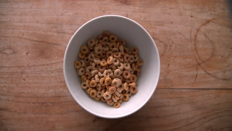 Point-Of-View-Shot-Of-Pouring-Breakfast-Cereal-Into-Bowl