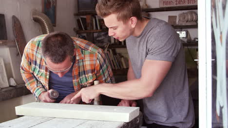 Stone-Mason-With-Apprentice-Working-Shot-On-RED-Camera