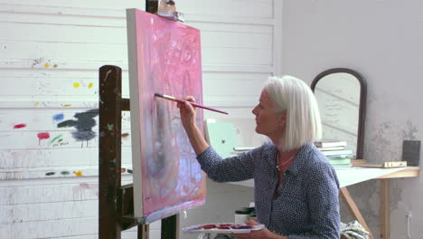 Female-Artist-Working-On-Painting-In-Studio-Shot-On-R3D