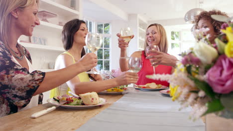 Female-Friends-Around-Table-At-Dinner-Party-Shot-On-R3D