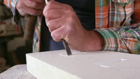 Stone-Mason-At-Work-On-Carving-In-Studio-Shot-On-RED-Camera