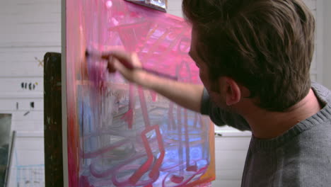 Male-Artist-Working-On-Painting-In-Studio-Shot-On-R3D