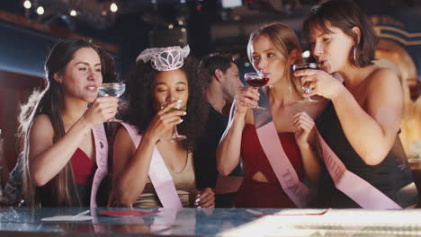 Group-Of-Female-Friends-Celebrating-With-Bride-On-Hen-Party-In-Bar
