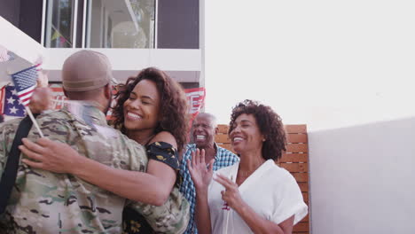 Mixed-race-wife-and-family-running-out-of-house-to-greet-a-soldier-returning-home