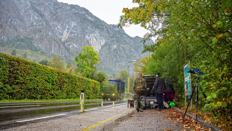 Timelpase-of-photographers-setting-up-camera-equipment-at-roadside-in-Austrian-Alps