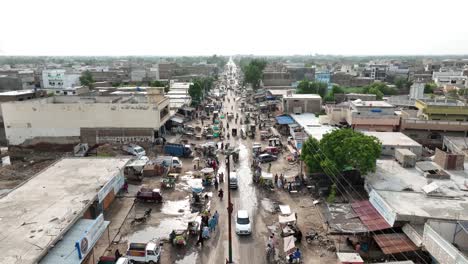 Aerial-Flying-Over-Busy-Road-With-Traffic-In-Badin,-Pakistan