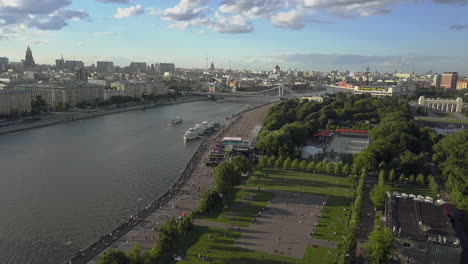 Aerial-summer-cityscape-of-Moscow-with-river-park-and-bridge
