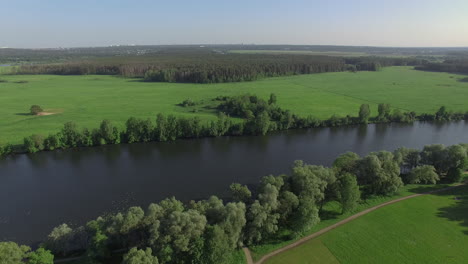 A-river-among-fields-and-forests