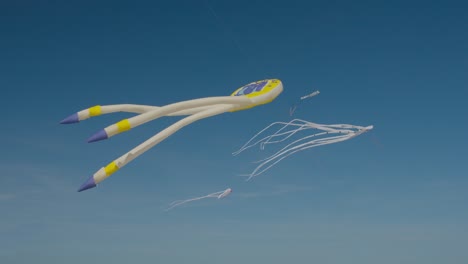 Giant-octopus-kites-flying-against-blue-sky-Wind-Festival-in-Valencia-Spain