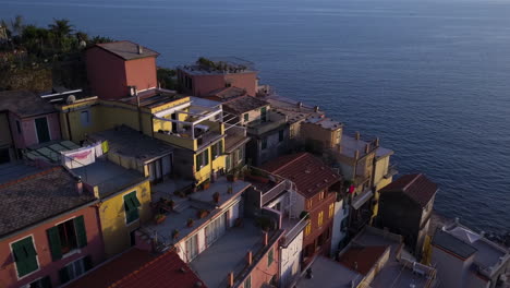 Aerial,-Traditional-Italian-Coast-Houses-in-Manarola,-Cinque-Terre,-Italy