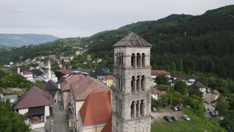 Scenic-aerial-orbit-around-ancient-bell-tower-Saint-Mary's-church-in-Jajce