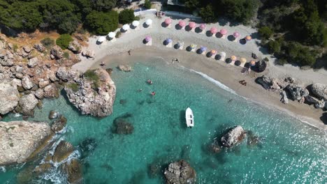 Drone-descends-as-clear-water-crashes-on-sandy-shores-of-the-Albanian-Riviera