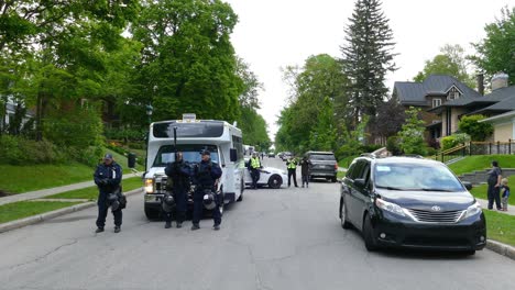 SWAT-Team-and-Police-Patrol-Neighborhood-Outside-2018-G7-Summit,-in-Quebec,-Canada