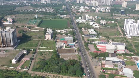 Rajkot-city-aerial-view-A-petrol-pump-is-visible-next-to-the-Raja-Hotel,-where-four-wheelers-are-lined-up-in-traffic
