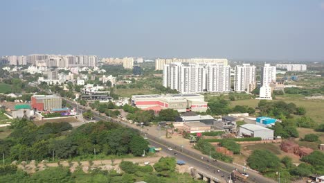 Rajkot-city-aerial-view-Drone-camera-Cosmoplex-Talkies-moving-forward-High-rise-buildings-are-visible-behind