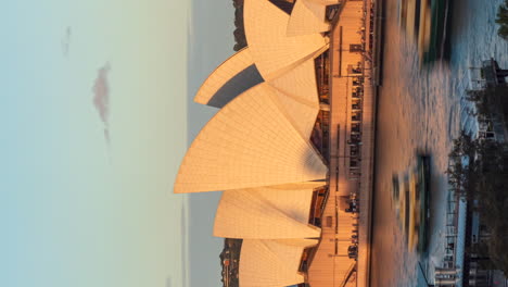 Vertical-right-to-left-tracking-of-Sydney-Opera-House,-sunset-timelapse