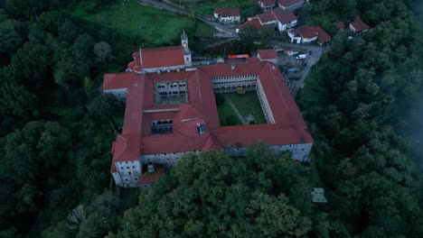 Santo-Estevo-Monastery-In-Foggy-And-Dark-Day,-Aerial-Shot,-Luintra,-Spain
