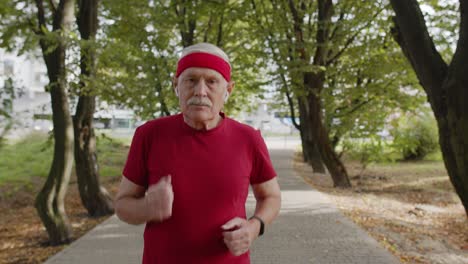 Elderly-sport-runner-man-training.-Workout-cardio-outside-in-park-at-morning.-Active-senior-people