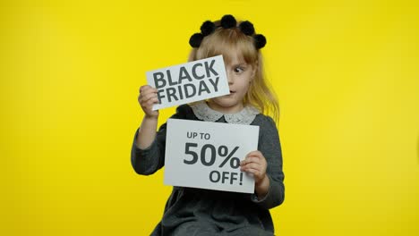 Child-girl-showing-Black-Friday-and-Up-To-50-Percent-Off-advertisement-banners.-Low-prices,-shopping