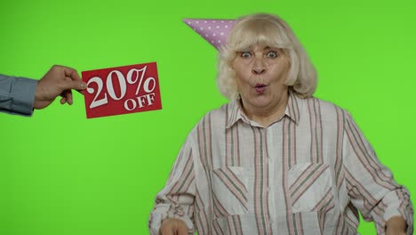 Inscription-20-Percent-Off-sale-appears-next-to-grandmother.-Woman-celebrating-with-shopping-bags